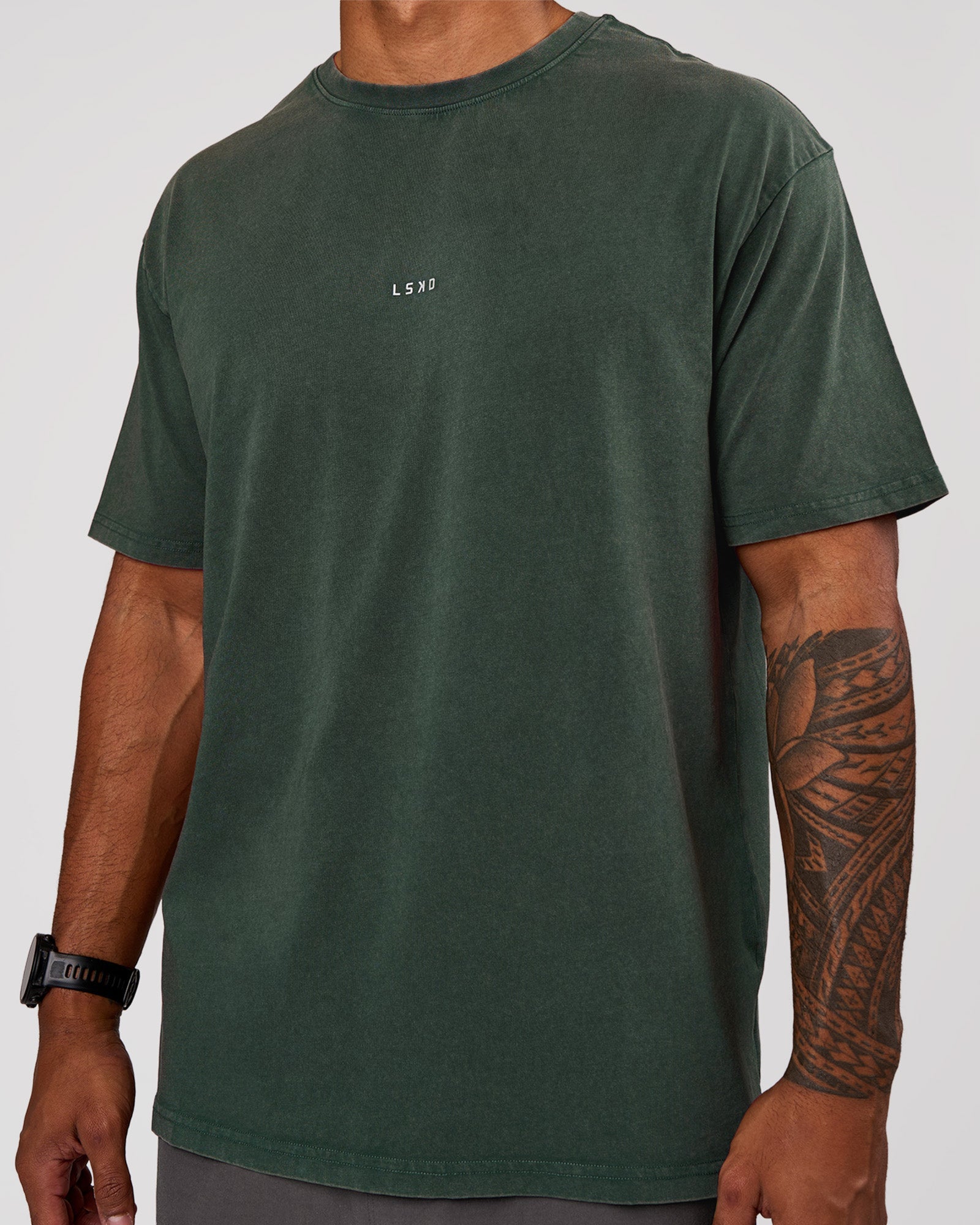Man wearing Base FLXCotton Tee Oversized - Midnight Green Washed | Model:Xav | Size:L