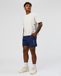 Man wearing Greatest of All Time Heavyweight FLXCotton Boxed Tee - Off White Washed | Model:Xav | Size:L | Thumbnail Index: 8