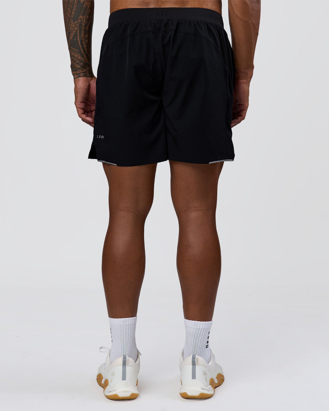 Man wearing Hybrid Lined 7" Short - Black | Model:Xav | Size:L - view 3