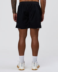 Man wearing Hybrid Lined 7" Short - Black | Model:Xav | Size:L | Thumbnail Index: 2