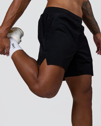 Man wearing Hybrid Lined 7" Short - Black | Model:Xav | Size:L | Thumbnail Index: 3