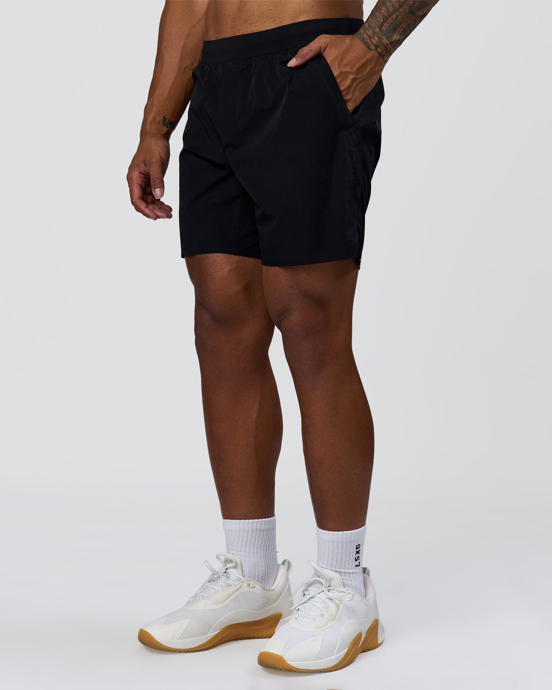 Man wearing Hybrid Lined 7" Short - Black | Model:Xav | Size:L - view 5