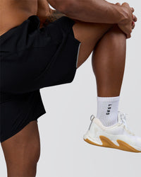 Man wearing Hybrid Lined 7" Short - Black | Model:Xav | Size:L | Thumbnail Index: 10