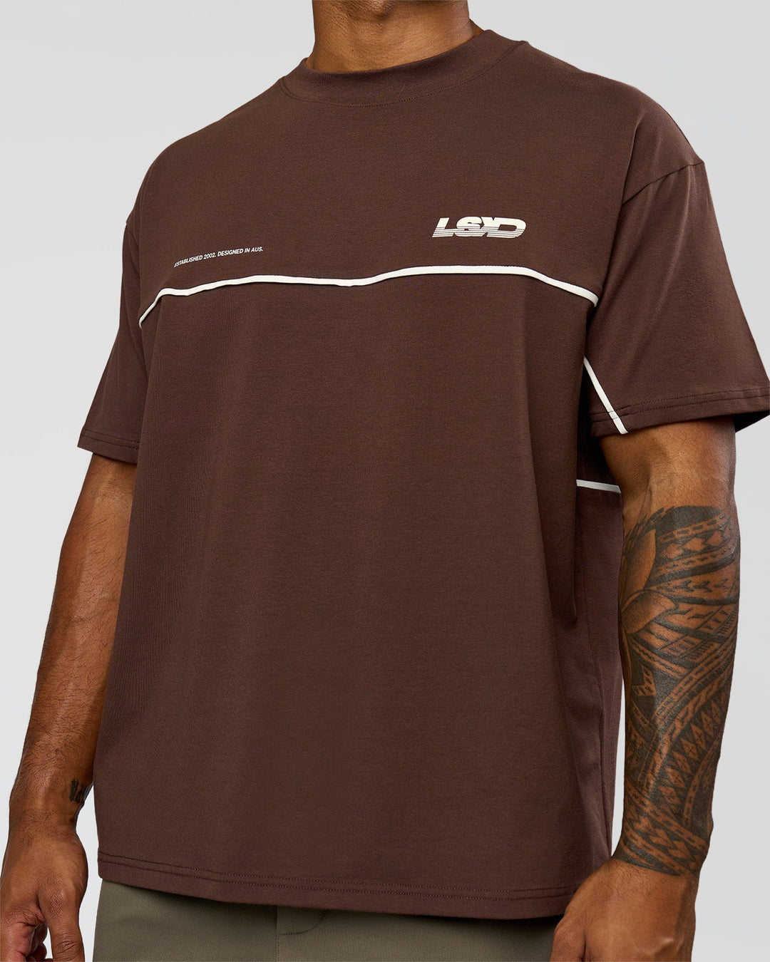 Man wearing Inline Heavyweight FLXCotton Oversized Tee - Hot Chocolate-Off White | Model:Xav | Size:L - view 6