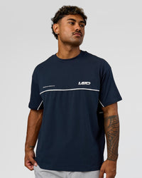 Man wearing Inline Heavyweight FLXCotton Oversized Tee - Midnight Navy-White | Model:Xav | Size:L | Thumbnail Index: 8