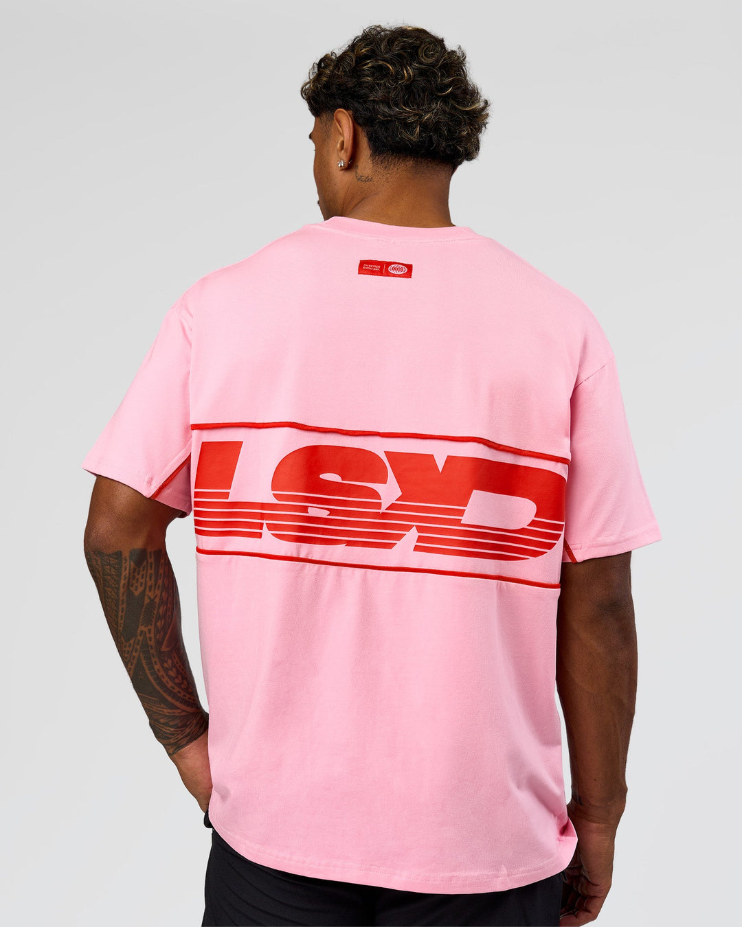 Man wearing Inline Heavyweight FLXCotton Oversized Tee - Pink Rose-Flame | Model:Xav | Size:L - view 2