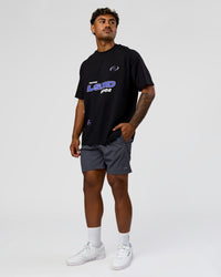 Man wearing League Heavyweight FLXCotton Oversized Tee - Black-Power Cobalt | Model:Xav | Size:L | Thumbnail Index: 11