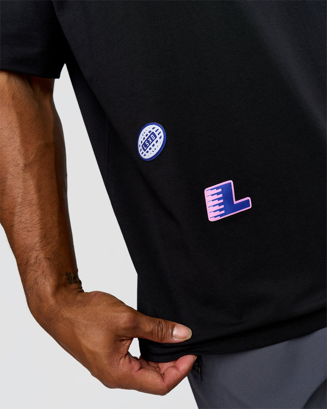 Man wearing League Heavyweight FLXCotton Oversized Tee - Black-Power Cobalt | Model:Xav | Size:L - view 3