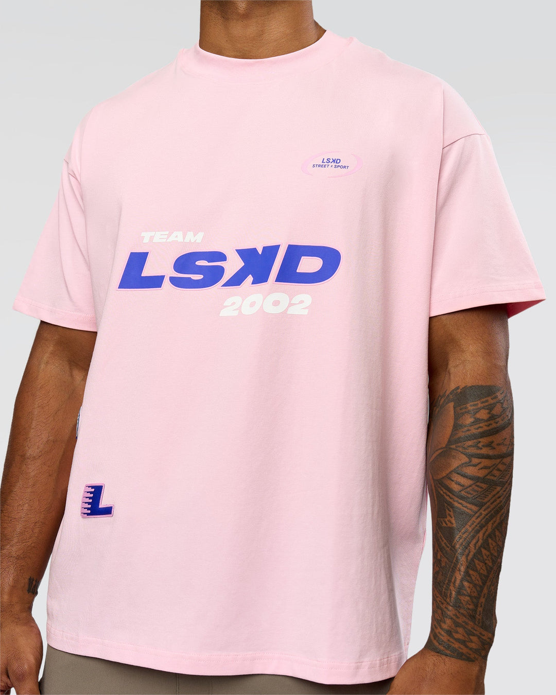 Man wearing League Heavyweight FLXCotton Oversized Tee - Marshmallow-Power Cobalt | Model:Xav | Size:L - view 3