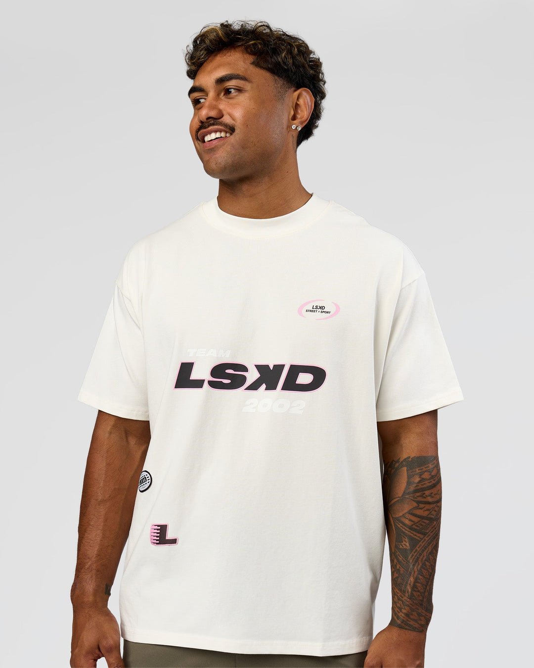 Man wearing League Heavyweight FLXCotton Oversized Tee - Off White-Ground Coffee | Model:Xav | Size:L - view 4