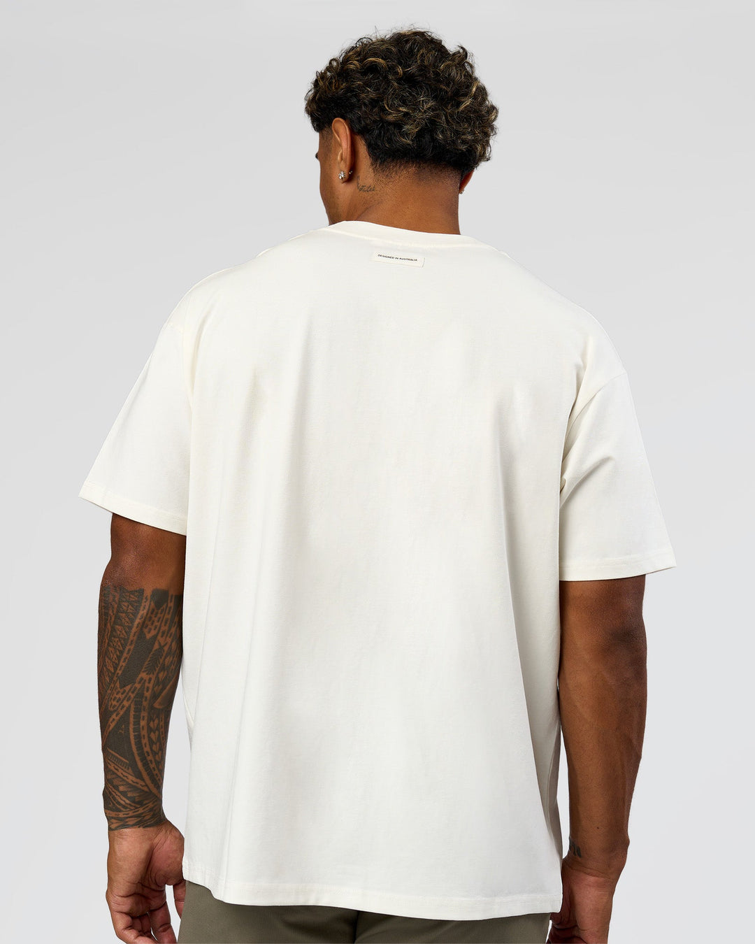 Man wearing League Heavyweight FLXCotton Oversized Tee - Off White-Ground Coffee | Model:Xav | Size:L - view 7