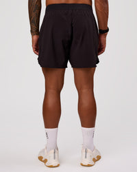 Man wearing Lift 6" Short - Black-Reflective | Model:Xav | Size:L | Thumbnail Index: 7