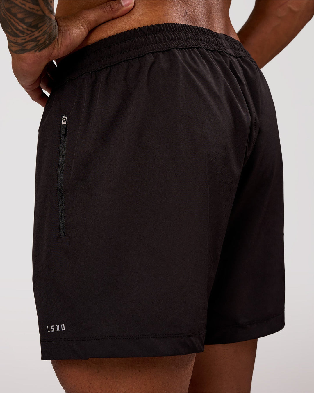 Man wearing Rep 5" Performance Short - Black | Model:Xav | Size:L - view 2