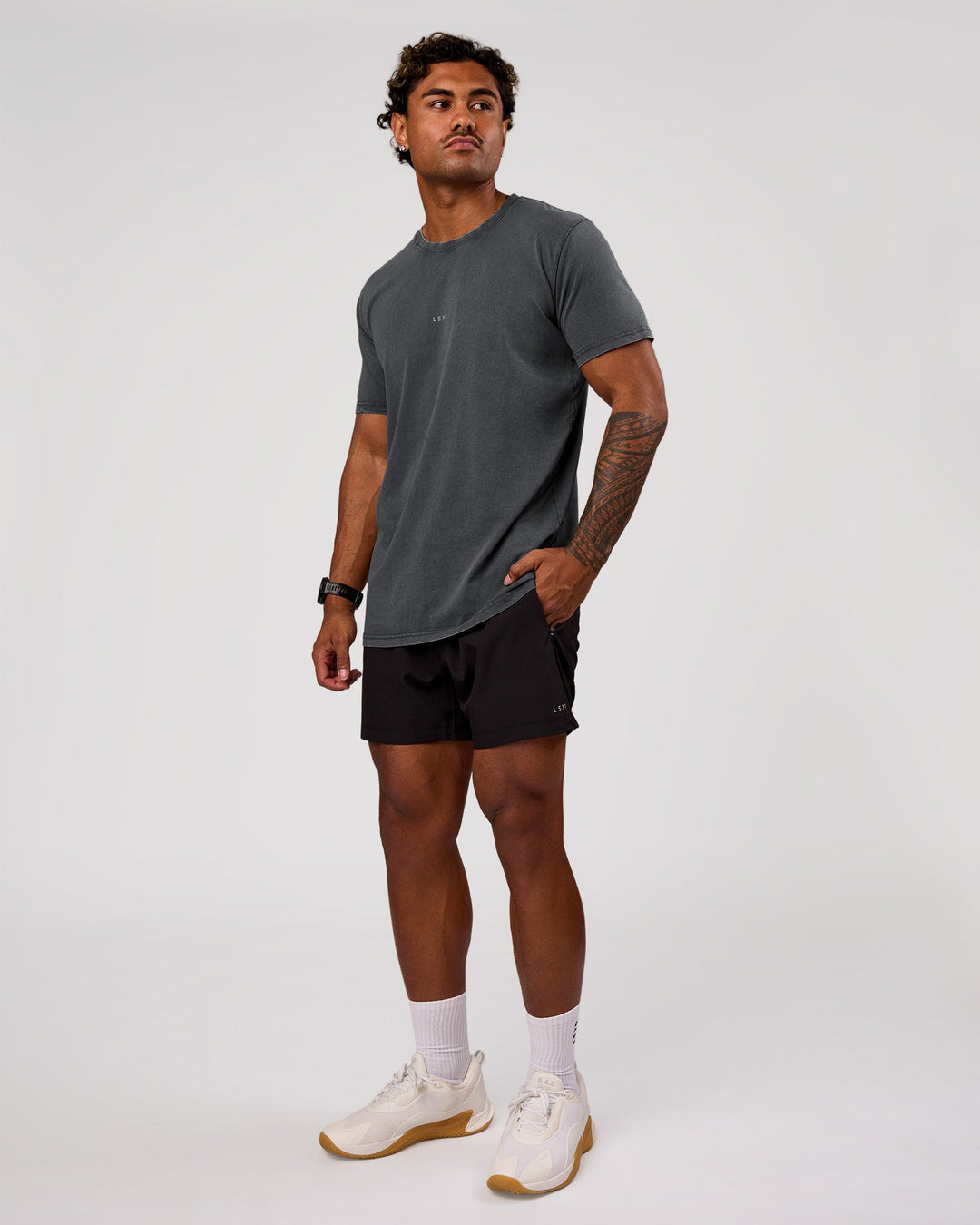 Man wearing Rep 5" Performance Short - Black | Model:Xav | Size:L - view 5