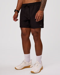 Man wearing Rep 5" Performance Short - Black | Model:Xav | Size:L | Thumbnail Index: 6