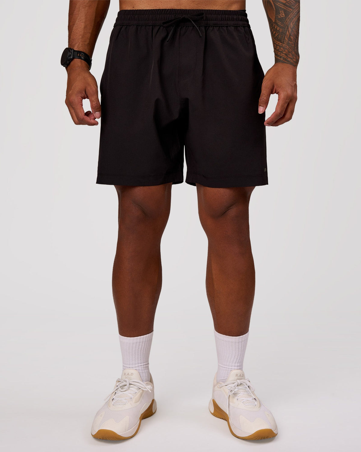 Man wearing Rep 7" Performance Short - Black-White | Model:Xav | Size:L
