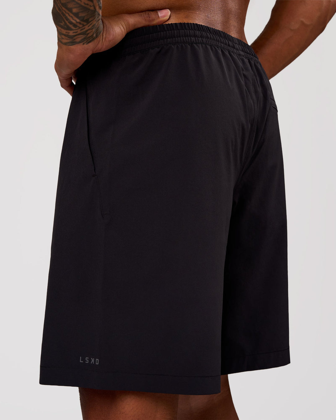 Man wearing Rep Movement 9" Training Short - Black | Model:Xav | Size:L - view 7
