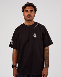 Man wearing Values Manifesto Heavyweight Oversized Tee  - Black-White | Model:Xav | Size:L | Thumbnail Index: 4