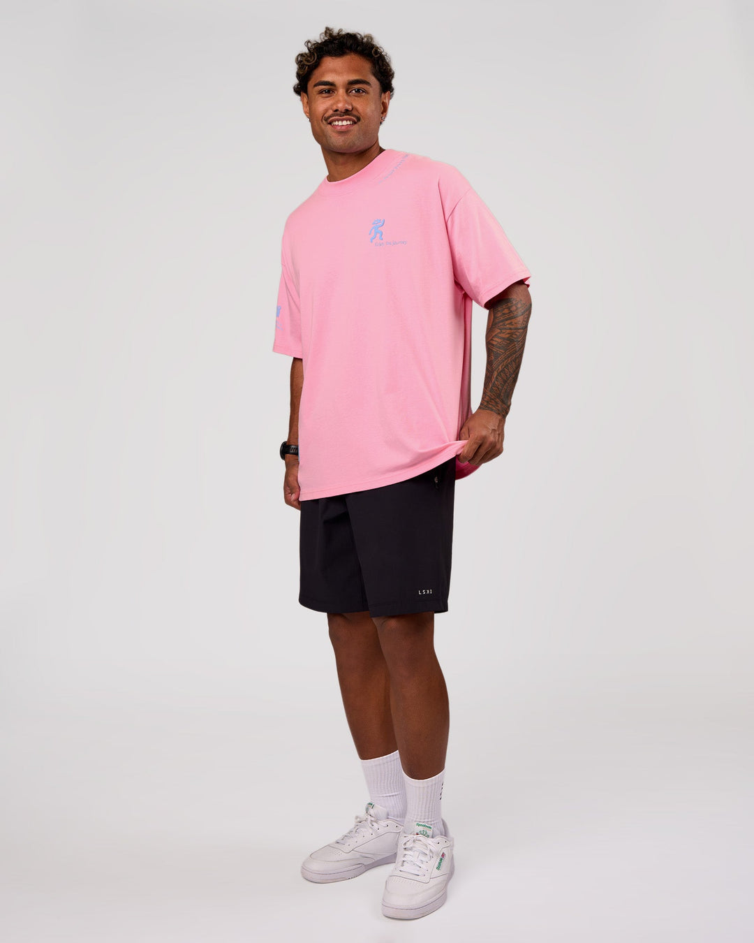 Man wearing Values Manifesto Heavyweight Oversized Tee  - Pink Rose-Open Air | Model:Xav | Size:L - view 9