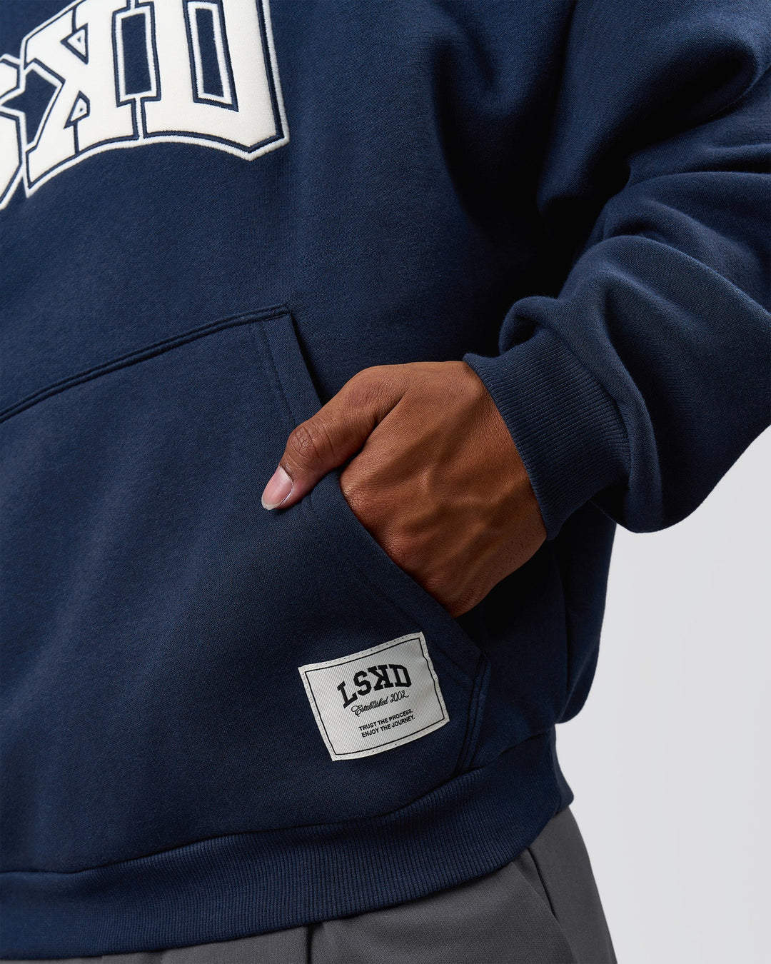 Man wearing Varsity Boxy Hoodie - Future Navy-White | Model:Xav | Size:L - view 9