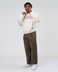 Man wearing Varsity Boxy Hoodie - Off White-Pink Rose | Model:Xav | Size:L | Thumbnail Index: 6