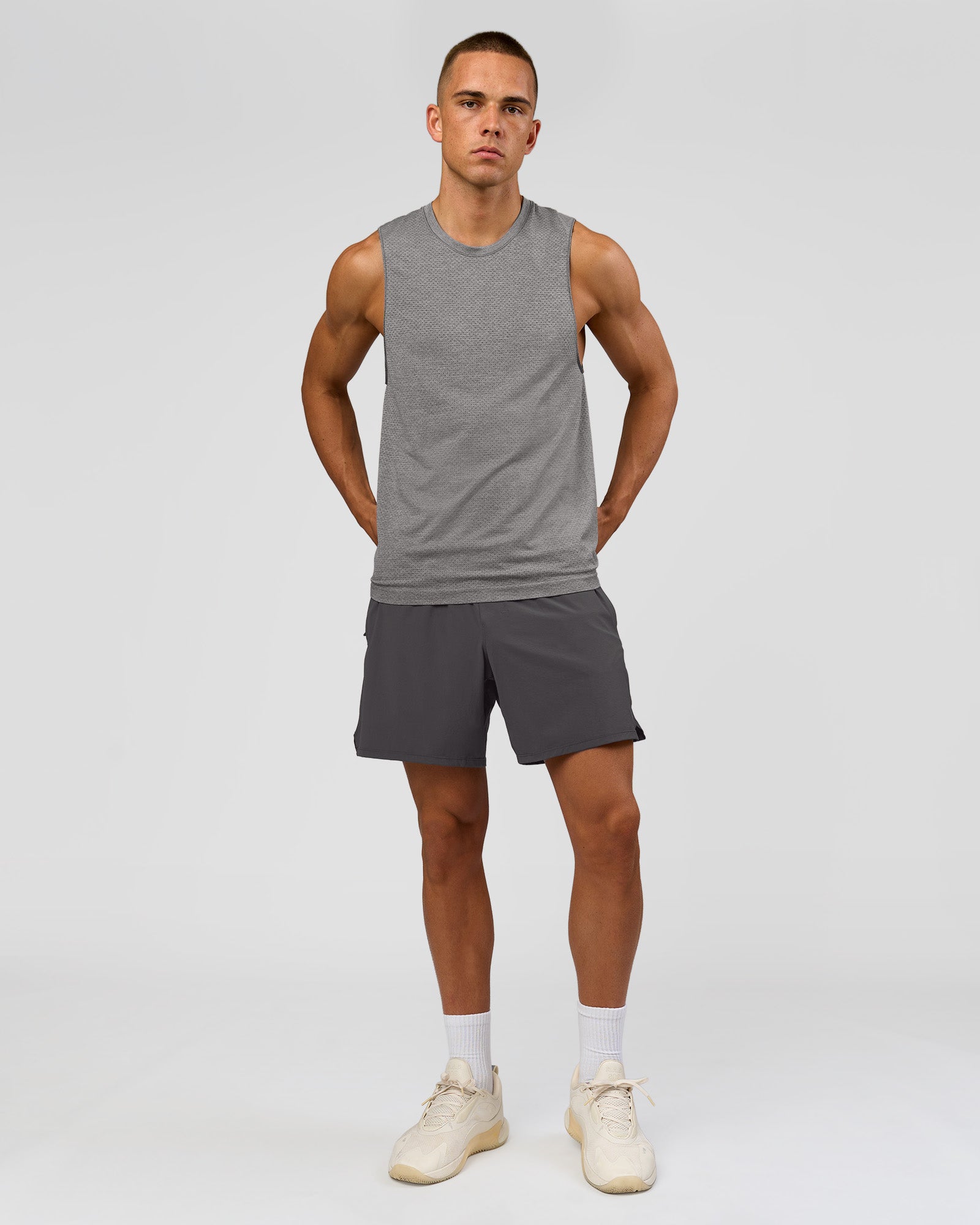 Man wearing AeroFLX+ Seamless Muscle Tank - Dark Storm/Alloy | Model:Albert | Size:M