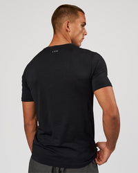 Man wearing AeroFLX+ Seamless Set In Tee - Black Marl | Model:Albert | Size:M | Thumbnail Index: 2