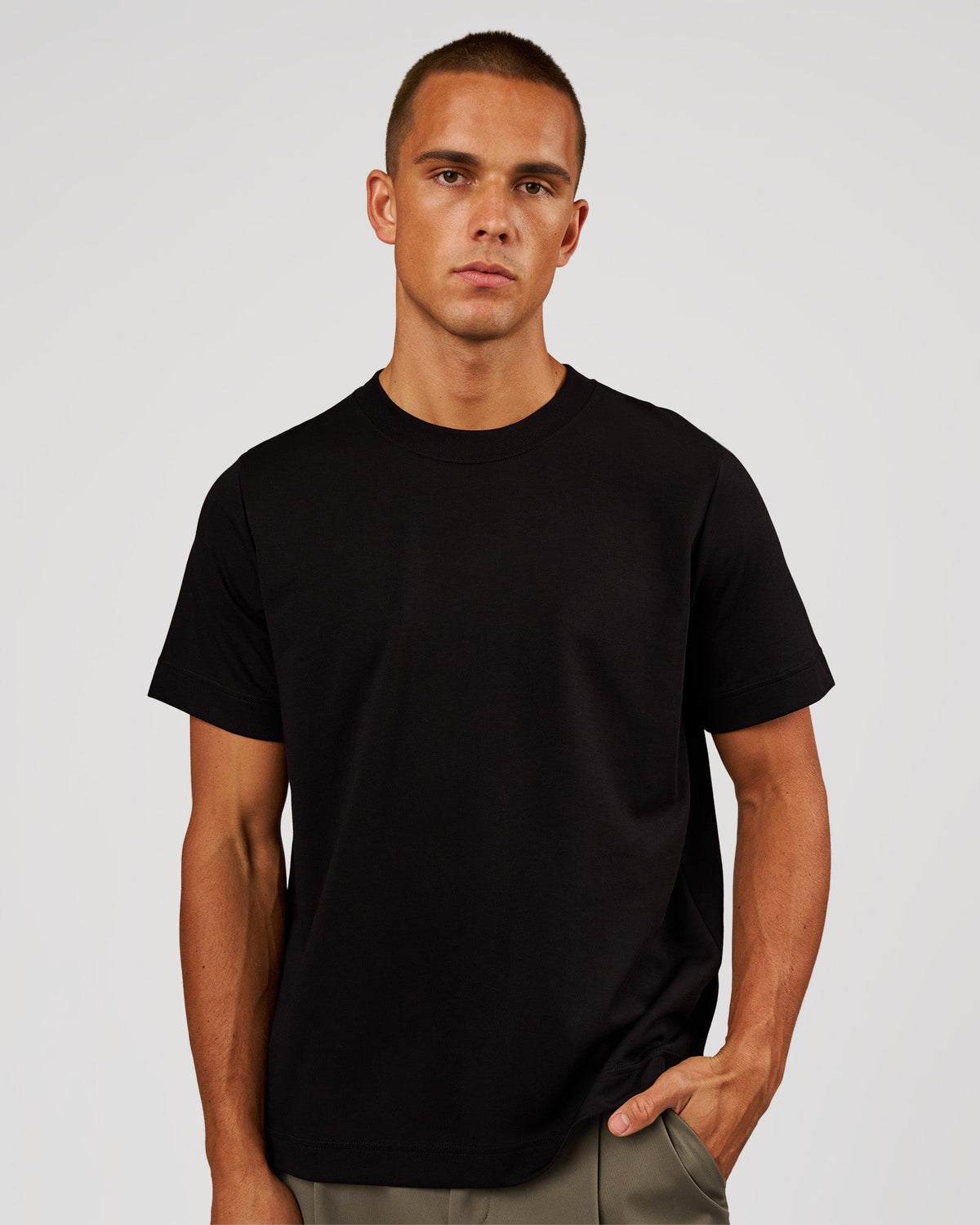 Man wearing AfterDark ZeroCrease Regular Tee - Black | Model:Albert | Size:M