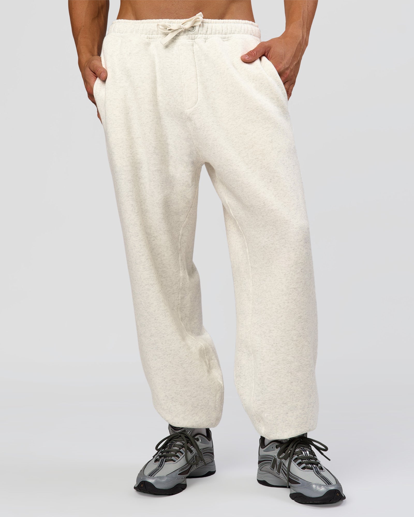 Man wearing Base Baggy Cuffed Track Pant - Silver Marl | Model:Albert | Size:M