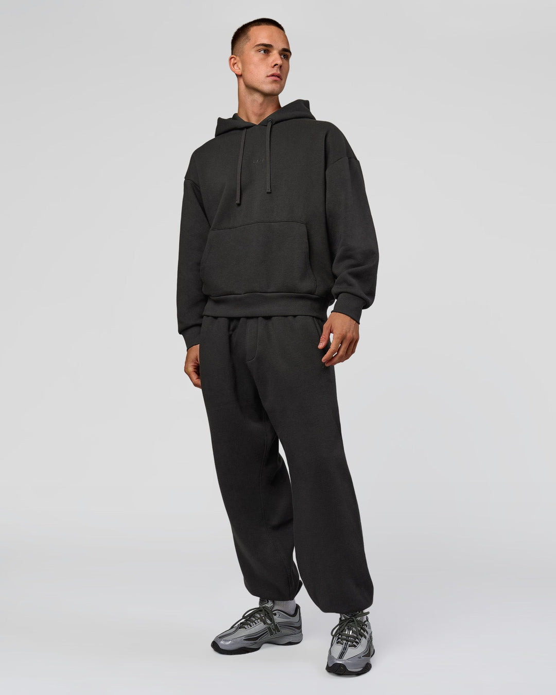 Man wearing Base Oversized DC Hoodie - Onyx | Model:Albert | Size:M - view 13