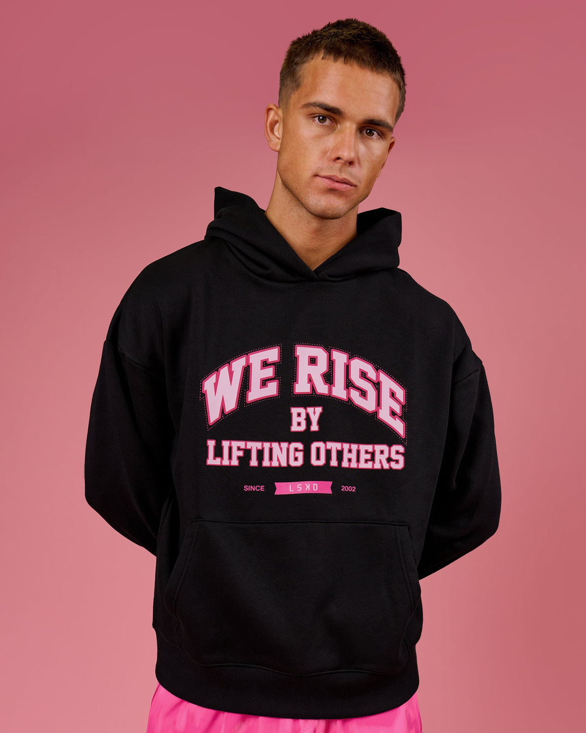 Man wearing BCAM Unisex Oversized Hoodie - Black | Model:Albert | Size:M