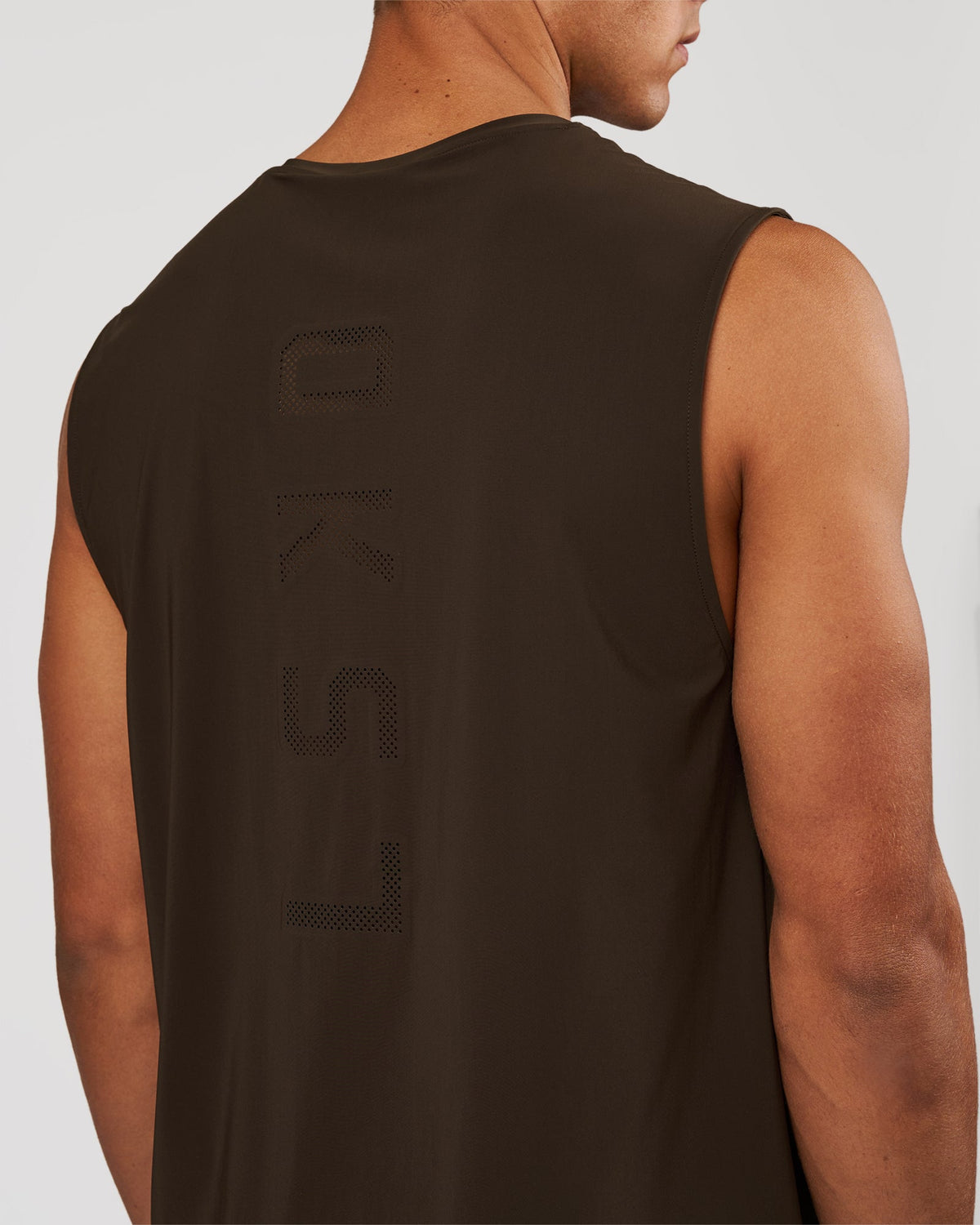Man wearing Cadence Swift Muscle Tank - Ground Coffee | Model:Albert | Size:M