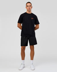 Man wearing Coffee Run FLXCotton Oversized Tee - Black-Ultra Orange | Model:Albert | Size:M | Thumbnail Index: 4