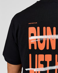 Man wearing Coffee Run FLXCotton Oversized Tee - Black-Ultra Orange | Model:Albert | Size:M | Thumbnail Index: 10