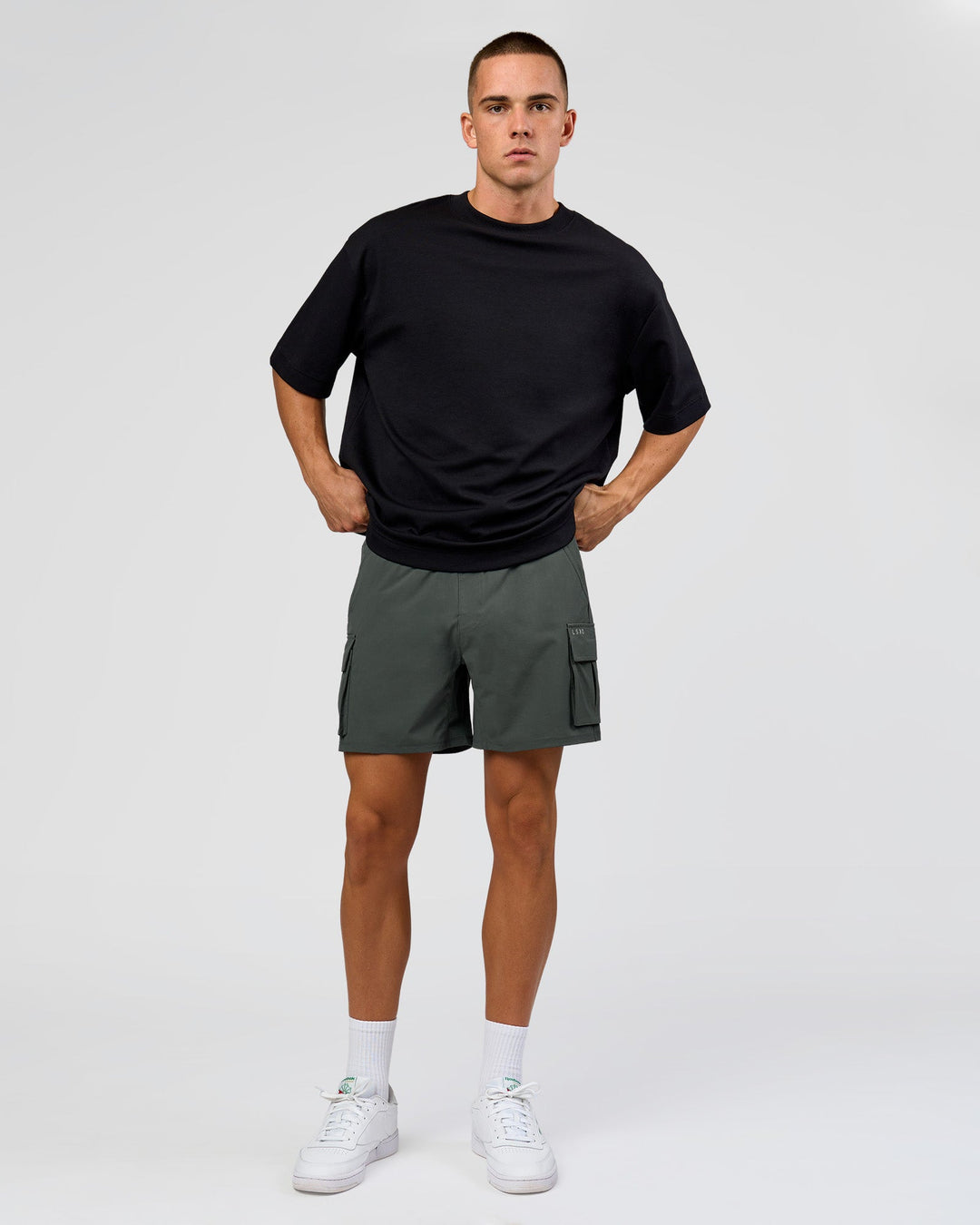 Man wearing Functional Cargo 6" Short - Carbon Green | Model:Albert | Size:M - view 2