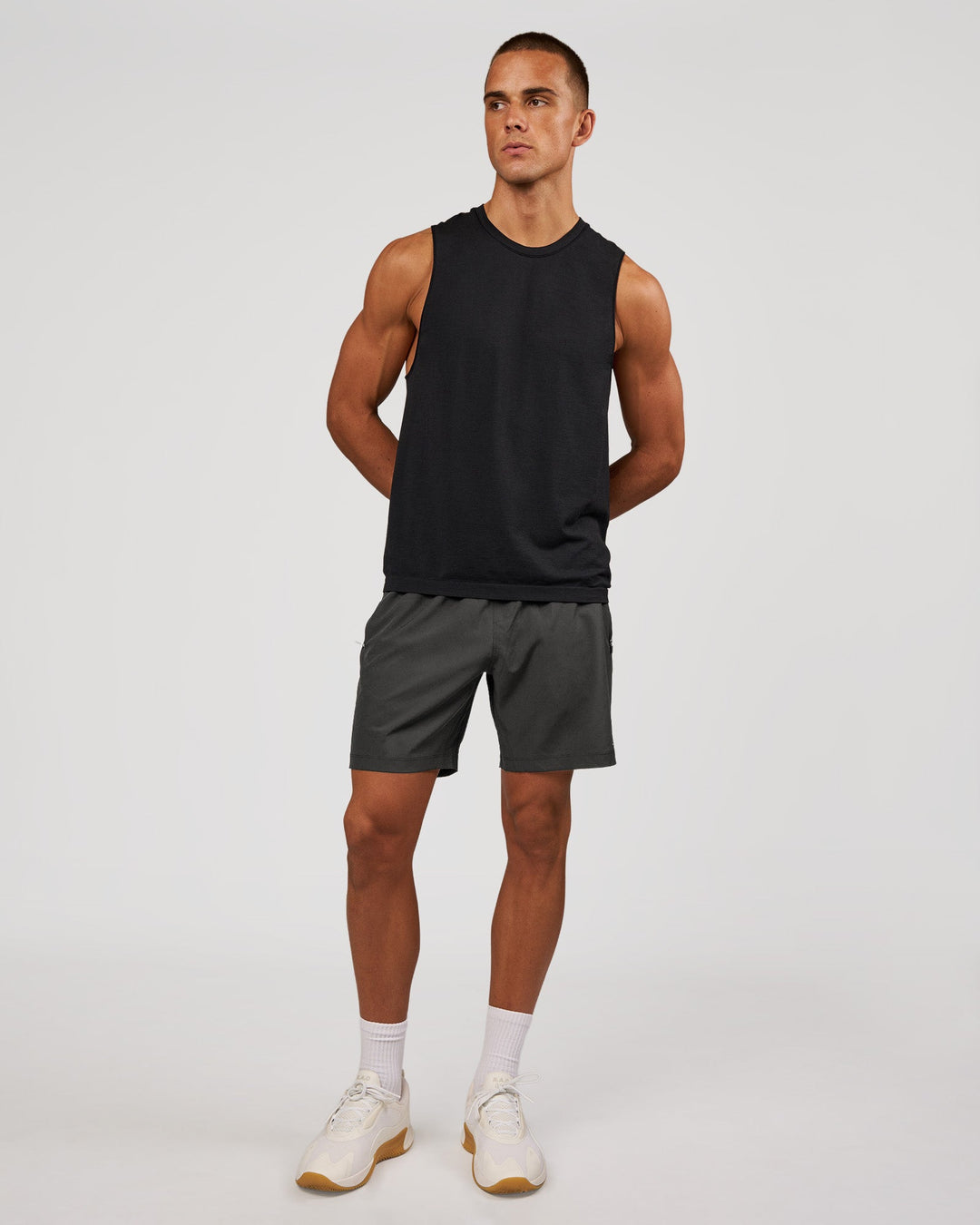 Man wearing AeroFLX+ Seamless Muscle Tank - Black Marl | Model:Albert | Size:M - view 4