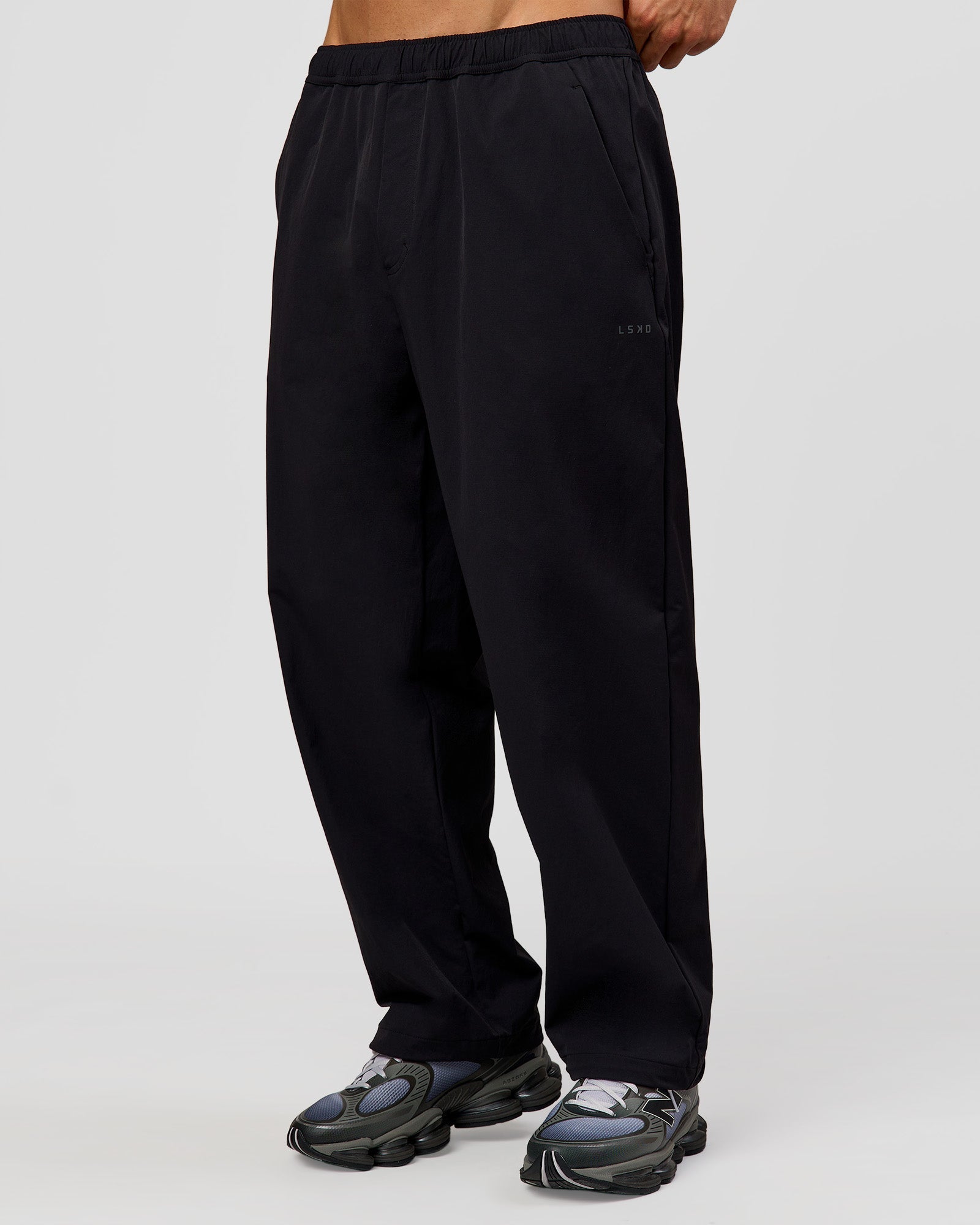Man wearing Motion Wide Leg Pant - Black | Model:Albert | Size:M
