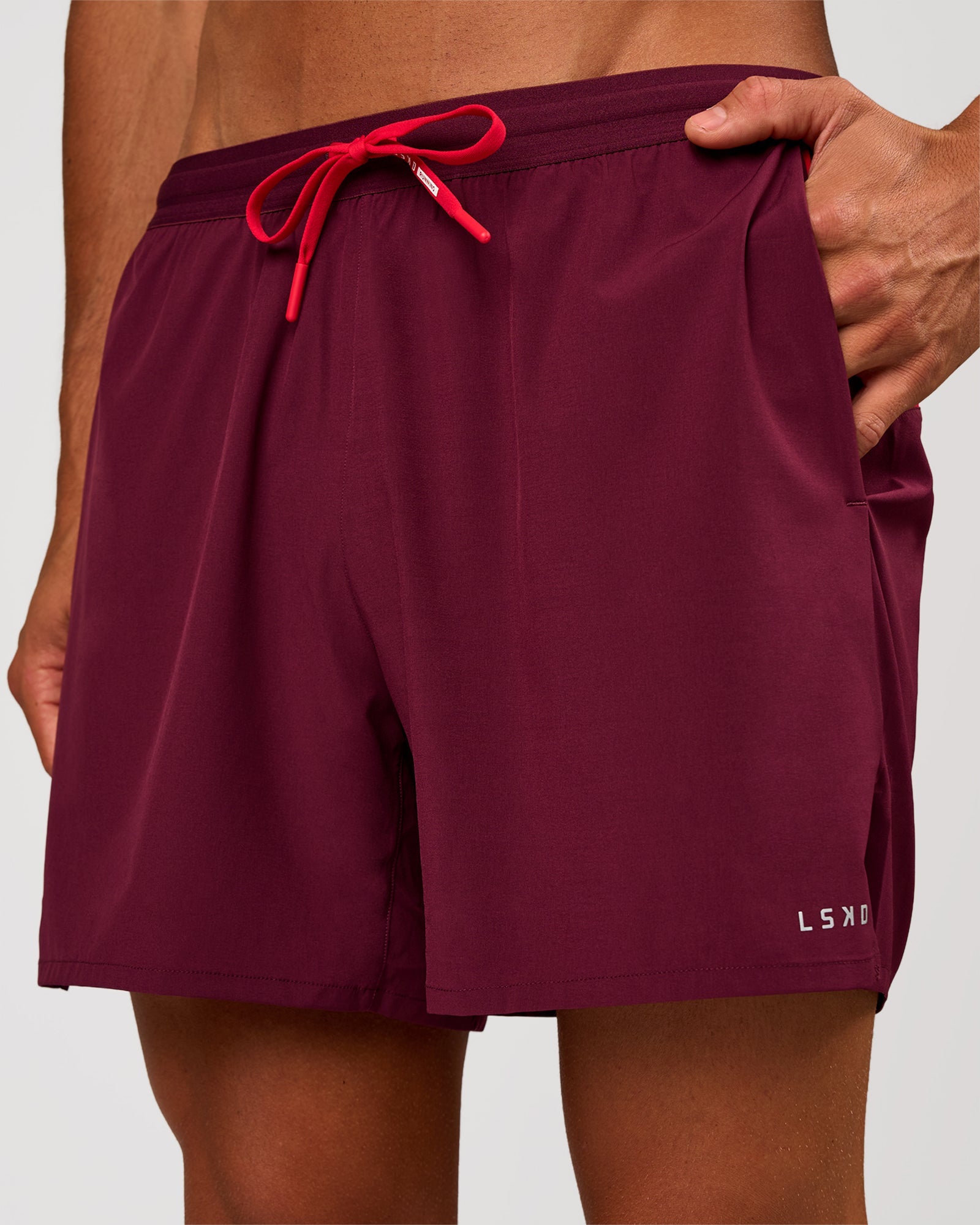 Man wearing Pace 5" Lined Running Short - Cherry Lacquer-Scarlet | Model:Albert | Size:M