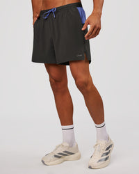 Man wearing Pace 5" Lined Running Short - Dark Storm-Bluebell | Model:Albert | Size:M | Thumbnail Index: 5