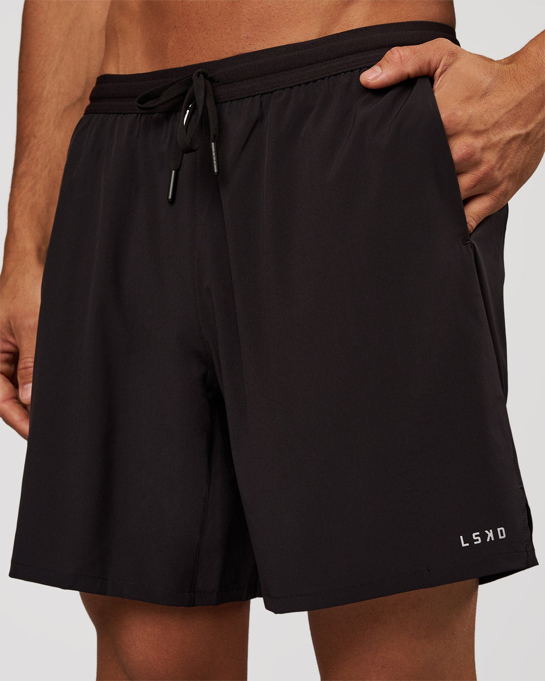 Man wearing Pace 7" Lined Running Short - Black-Reflective | Model:Albert | Size:M - view 1