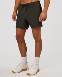 Man wearing Rep 5" Performance Short - Onyx | Model:Albert | Size:M | Thumbnail Index: 1