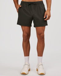 Man wearing Rep 5" Performance Short - Onyx | Model:Albert | Size:M | Thumbnail Index: 4