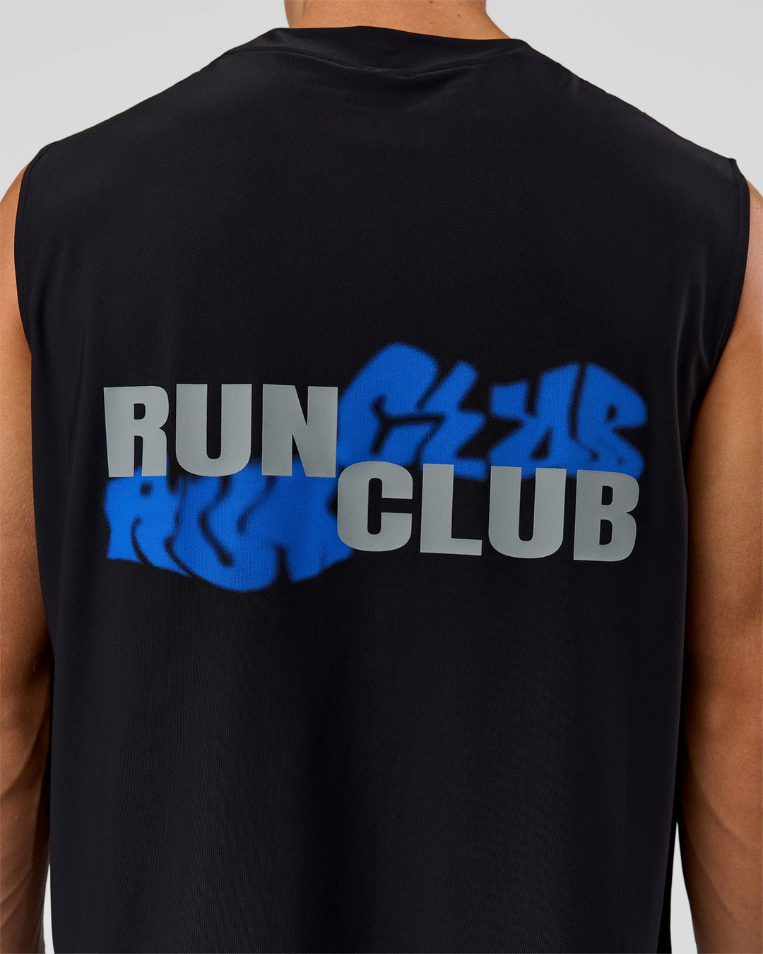 Man wearing Run Club Elevate Muscle Tank - Black-Electric Indigo | Model:Albert | Size:M
