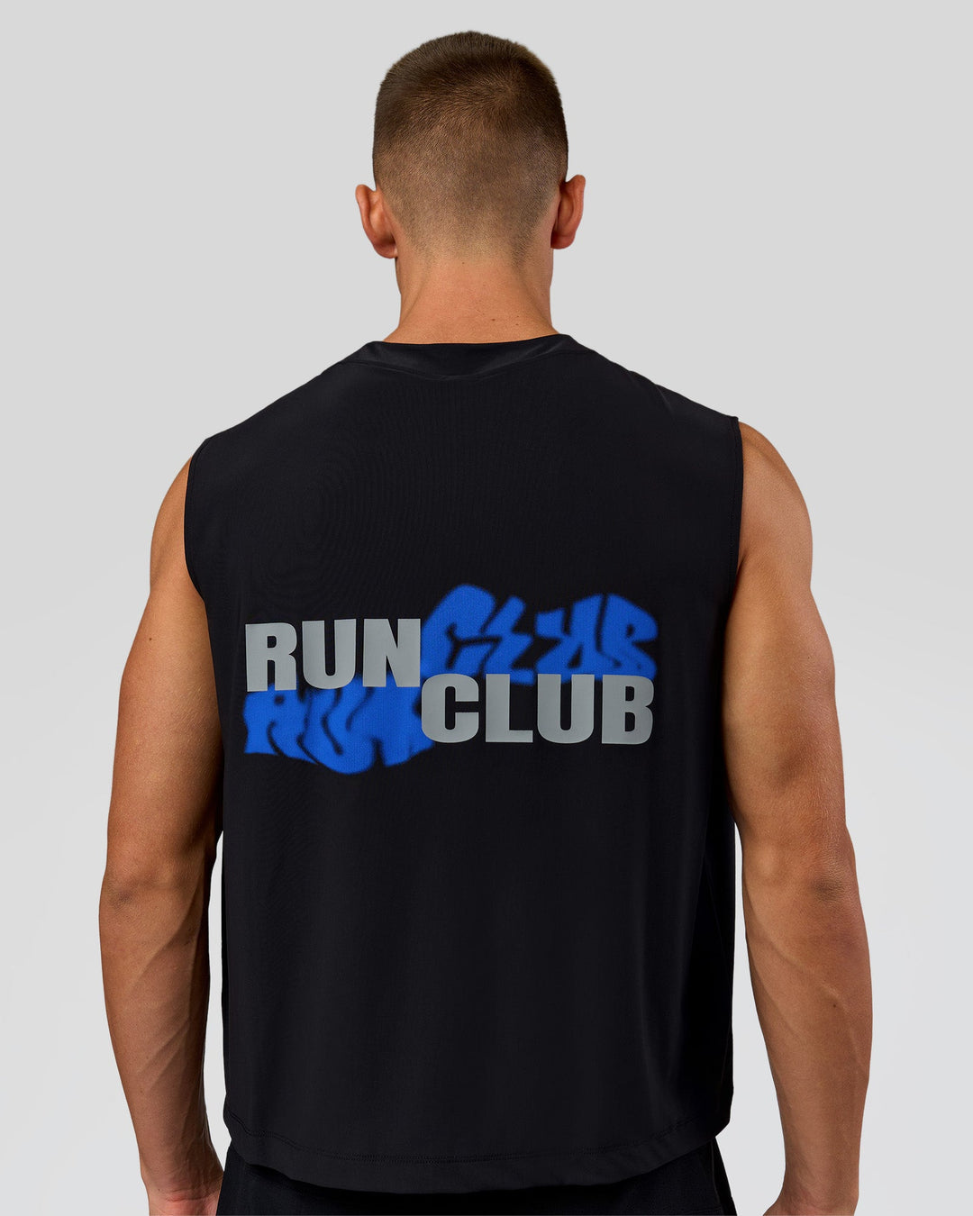 Man wearing Run Club Elevate Muscle Tank - Black-Electric Indigo | Model:Albert | Size:M