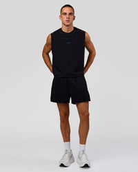 Man wearing Run Club Elevate Muscle Tank - Black-Electric Indigo | Model:Albert | Size:M