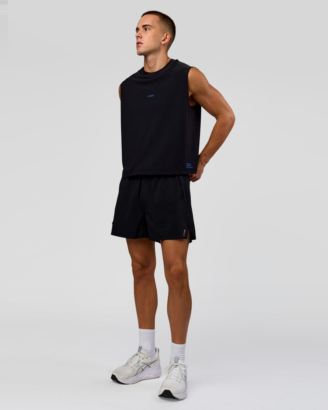 Man wearing Run Club Elevate Muscle Tank - Black-Electric Indigo | Model:Albert | Size:M