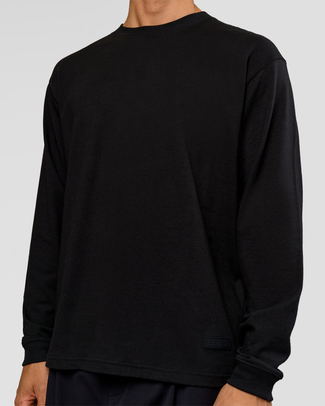 Man wearing Tonal Legacy Heavyweight Oversized LS Tee - Black-Black | Model:Albert | Size:M - view 3