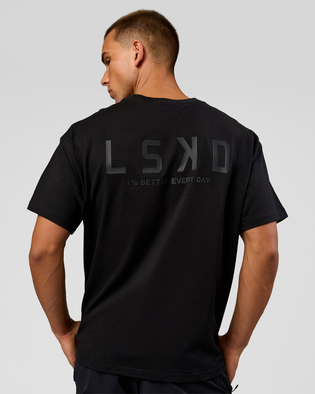 Man wearing Tonal Legacy Heavyweight Oversized Tee - Black-Black | Model:Albert | Size:M - view 2