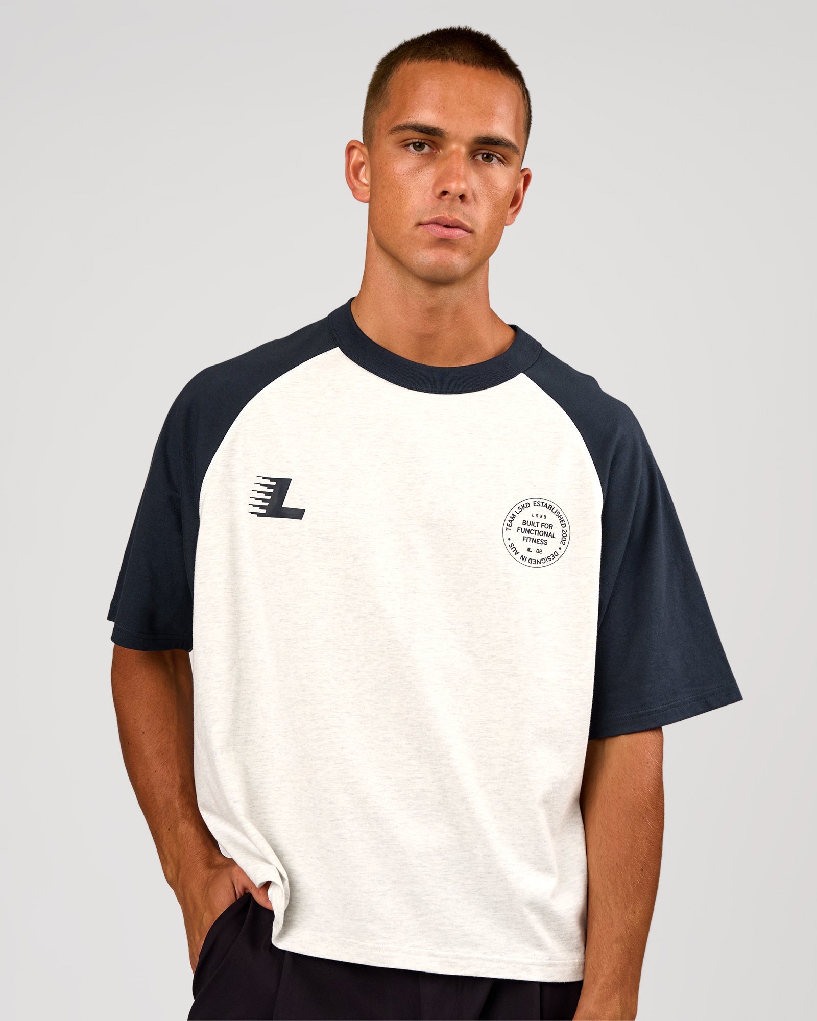 Man wearing Victory Heavyweight Boxed Raglan Tee - Silver Marl-Midnight Navy | Model:Albert | Size:M