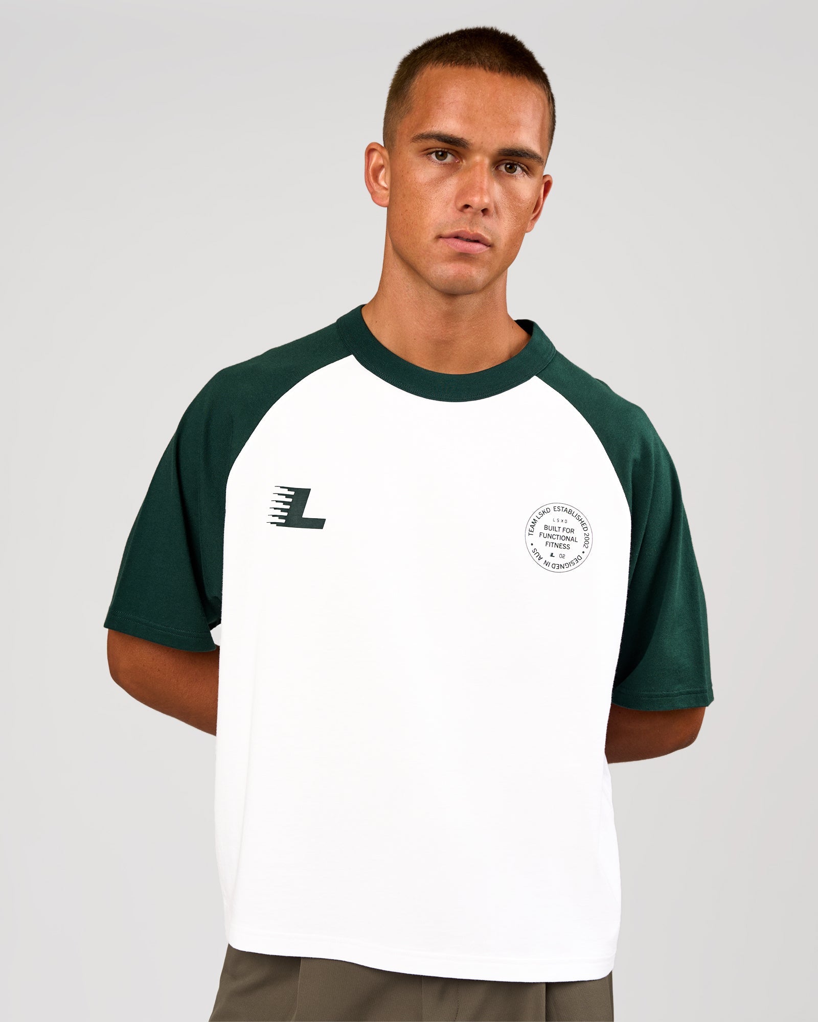 Man wearing Victory Heavyweight Boxed Raglan Tee - White-Midnight Green | Model:Albert | Size:M